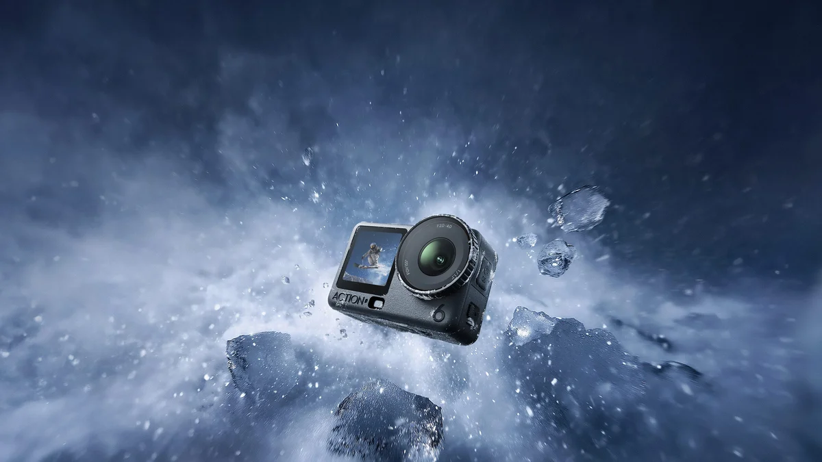 DJI Osmo Action 6 surrounded by ice and water spray demonstrating cold-resistance and waterproofing