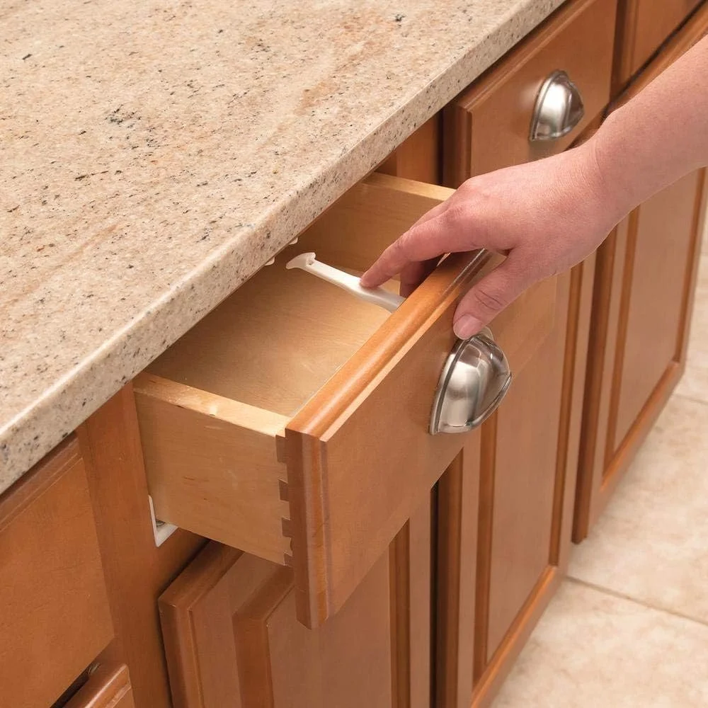 Safety 1st cabinet and drawer latch preventing a kitchen drawer from opening fully