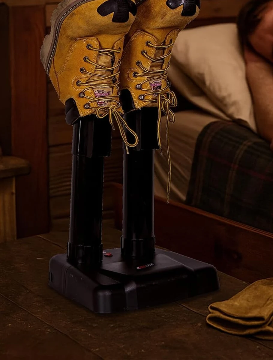 JobSite Silent Boot Dryer drying a pair of tan work boots on a bedside table overnight