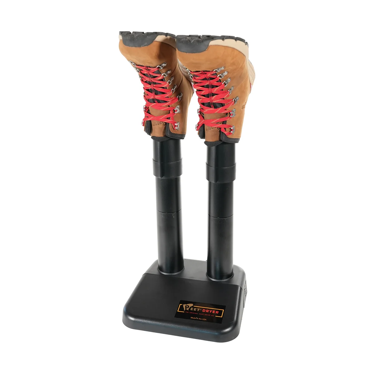 PEET Original boot dryer in use, drying a pair of tan Danner hiking boots with red laces on its heated tubes