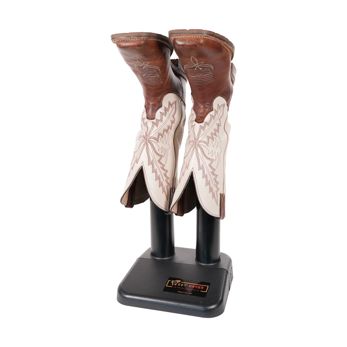 PEET Original boot dryer drying a pair of cream and brown leather cowboy boots on its tubes