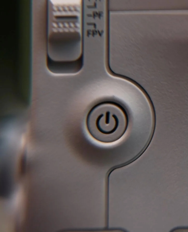DJI RS4 Mini control panel close-up showing the joystick, power button and mode selector