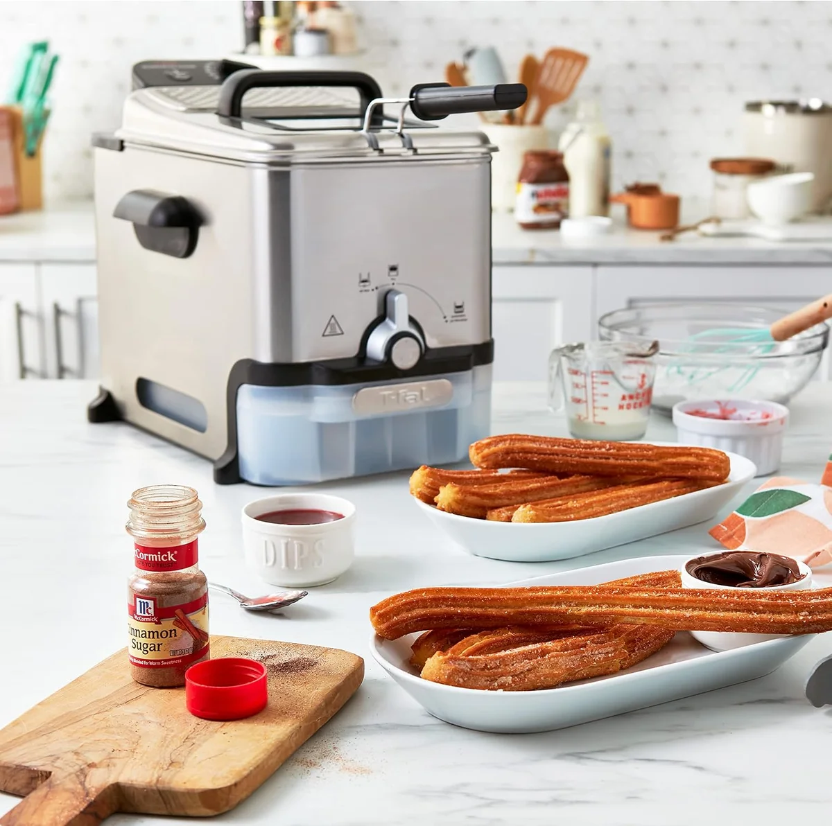 T-fal Ultimate EZ Clean deep fryer on a kitchen counter with freshly fried churros