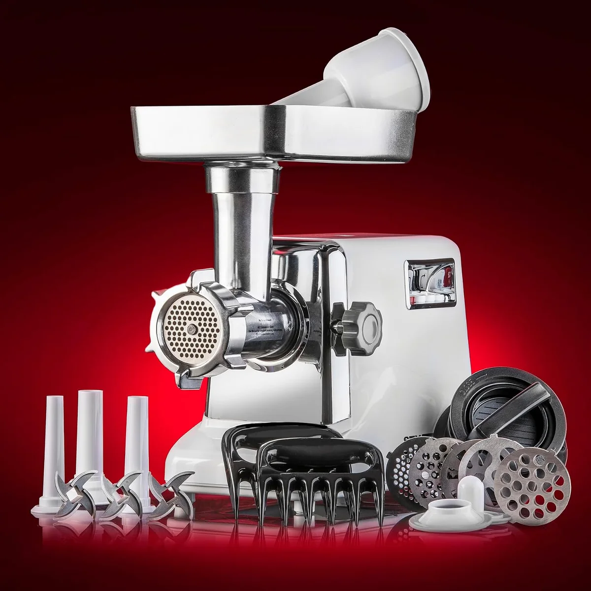 STX Turboforce 3000 meat grinder angled view with grinding plates, sausage stuffing tubes, and burger press