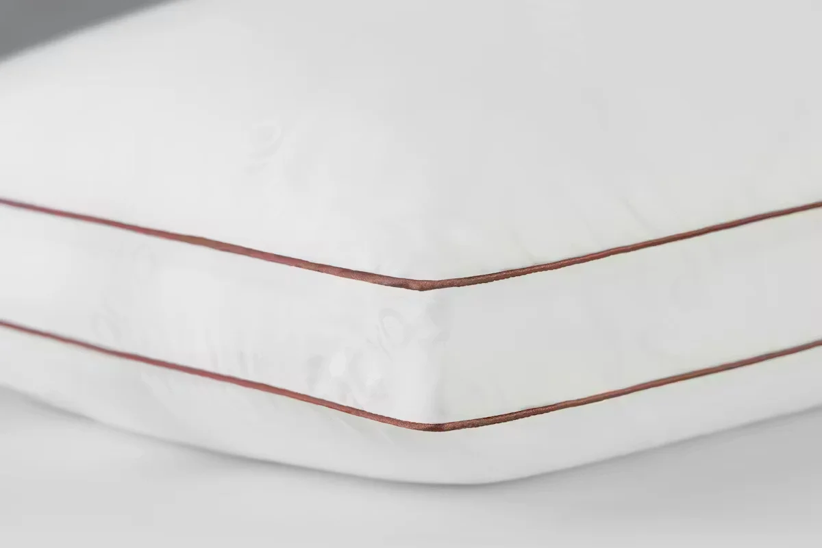 Saatva Latex Pillow corner close-up showing gusseted design and organic cotton cover
