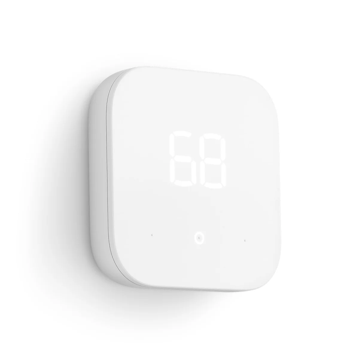 Amazon Smart Thermostat mounted on a white wall at a 3/4 angle showing the 68-degree display and three touch dots