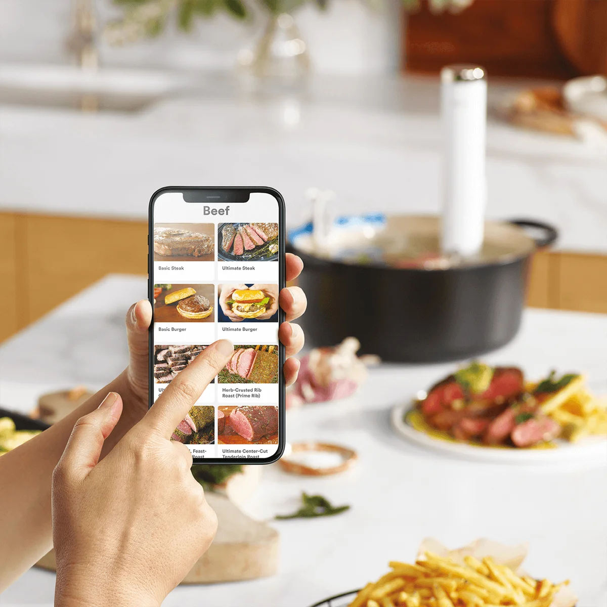 Breville Joule Turbo controlled from the Breville+ app recipe list on a smartphone in a kitchen