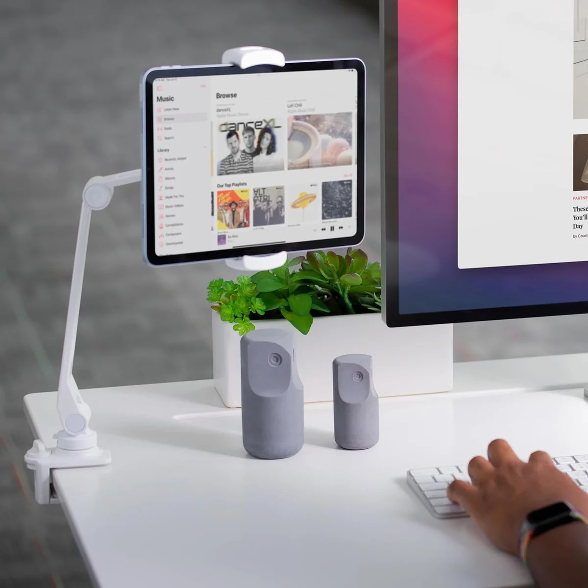 Twelve South HoverBar Duo white clamp mount holding iPad at desk next to Apple iMac in lifestyle setup