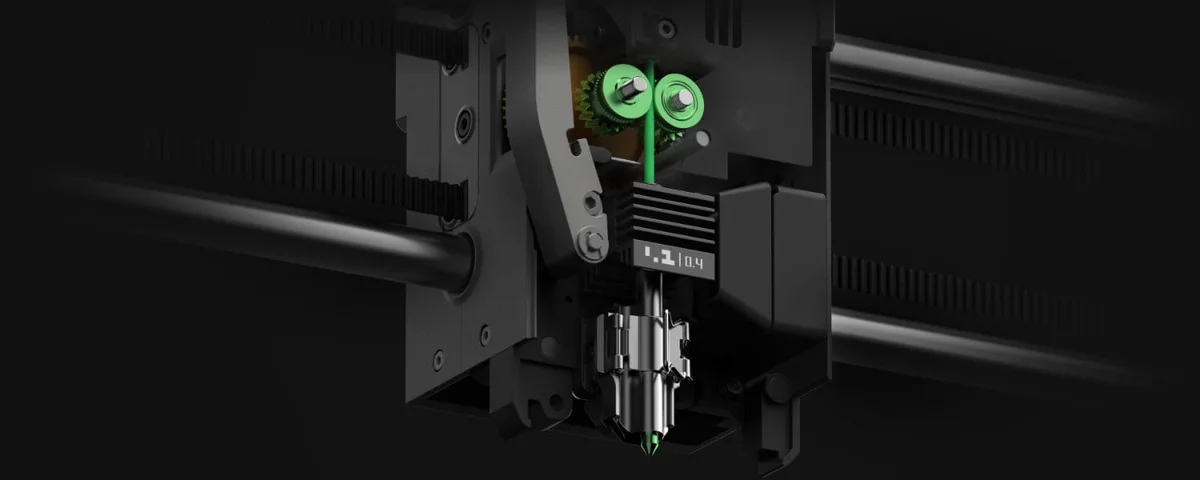 Bambu Lab P2S DynaSense extruder and quick-swap nozzle close-up with green indicator light