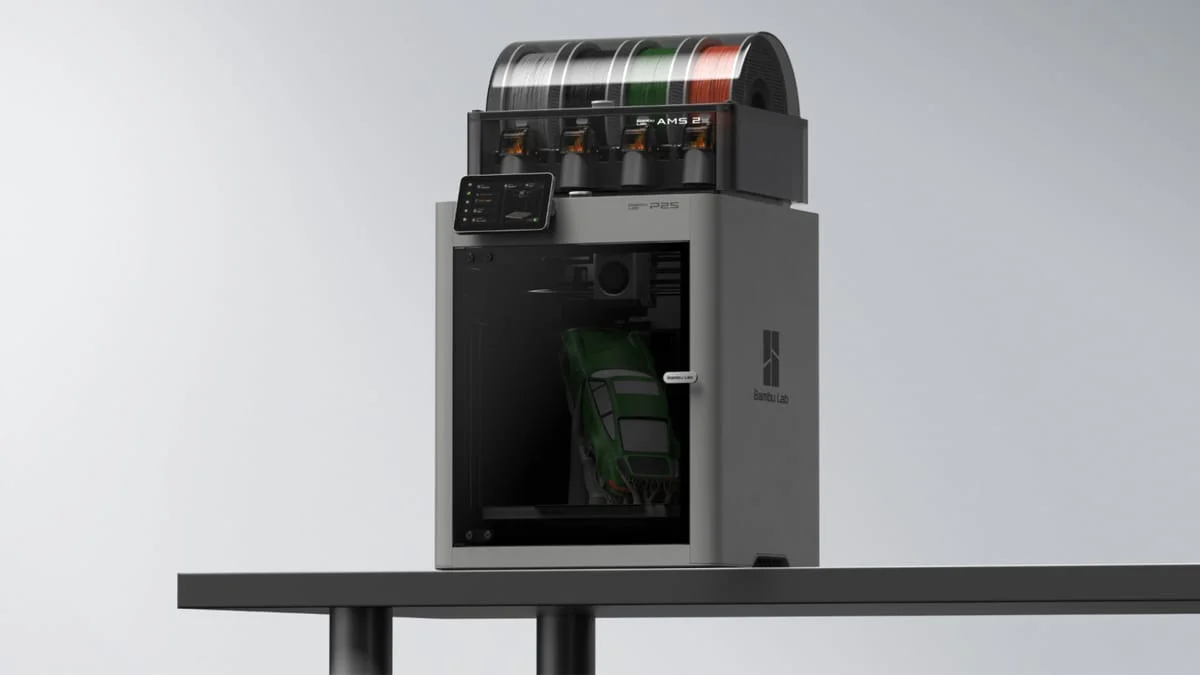 Bambu Lab P2S Combo with AMS2 Pro printing a multi-color car model, 3/4 angle view