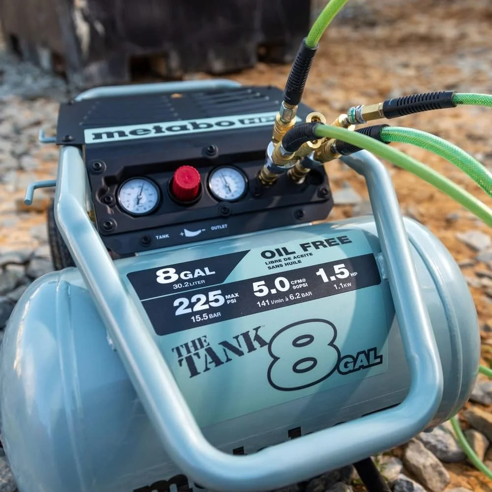 Metabo HPT EC1315SM dual hose outlets on gravel jobsite with two air hoses connected