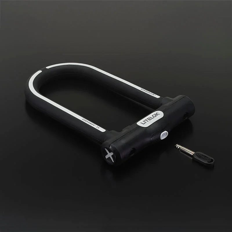 Litelok X1 U-lock 3/4 angle view with key on dark background
