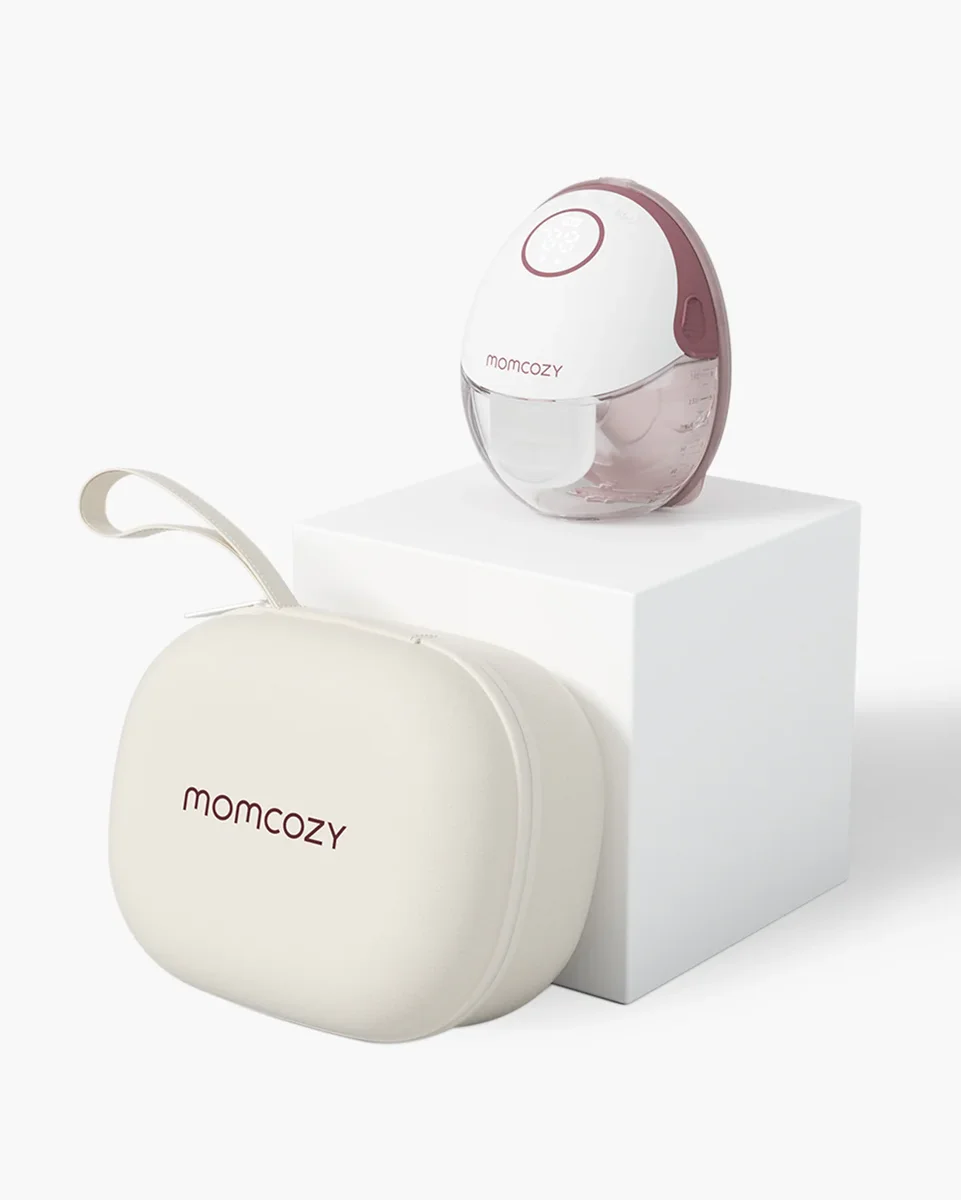 Momcozy M6 single breast pump unit and carrying case on white pedestal