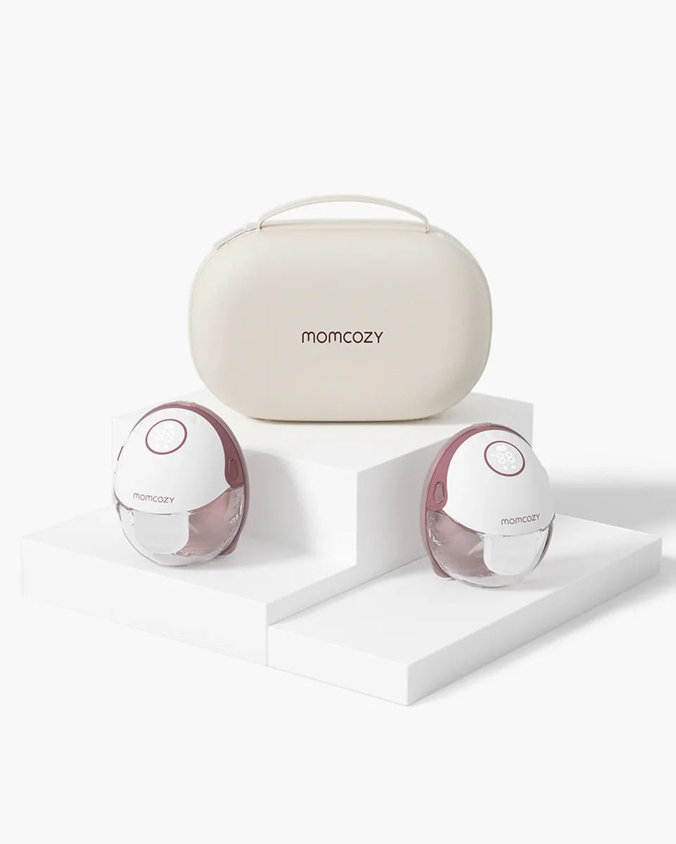 Momcozy M6 wearable breast pump pair with carrying case on white pedestals
