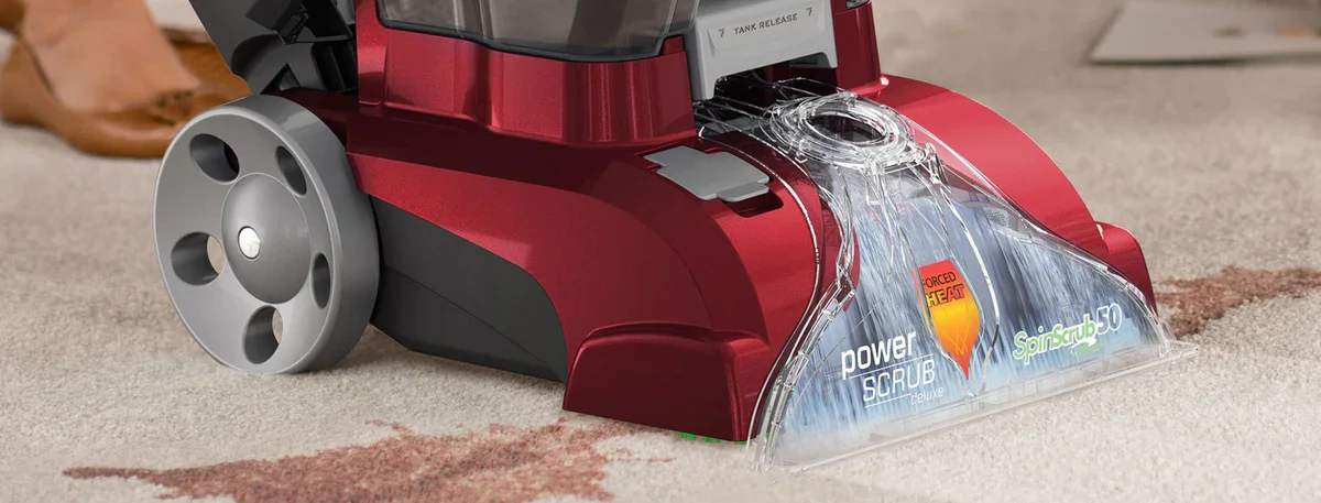 Hoover Power Scrub Deluxe cleaning head in action on carpet, SpinScrub brushes visible
