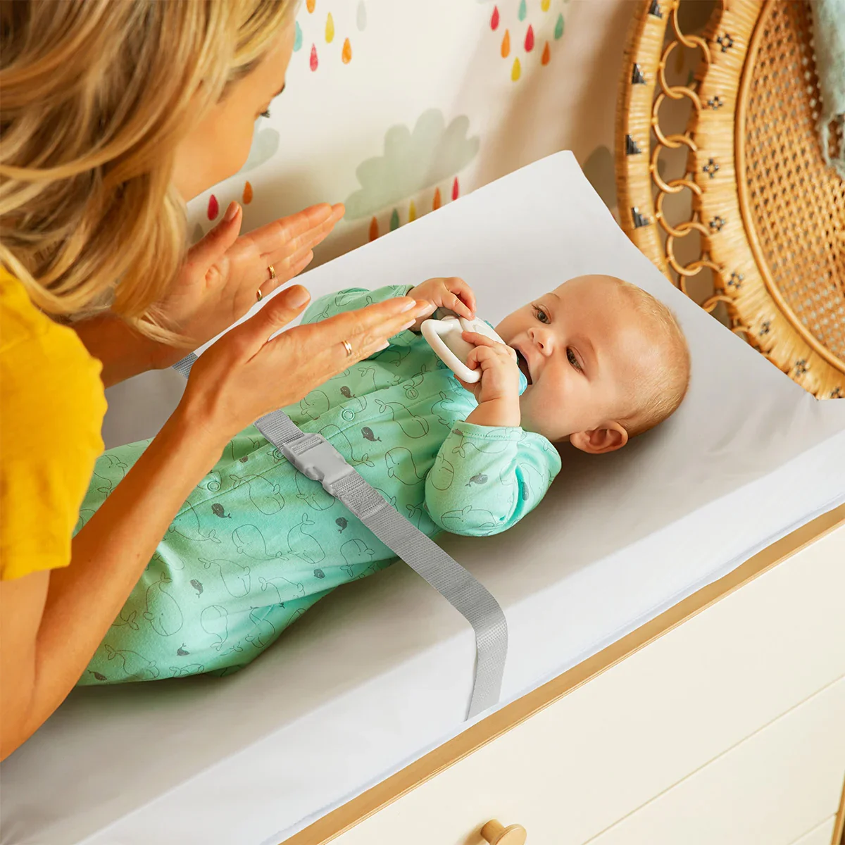 Munchkin Secure Grip Changing Pad in use with baby being changed by parent