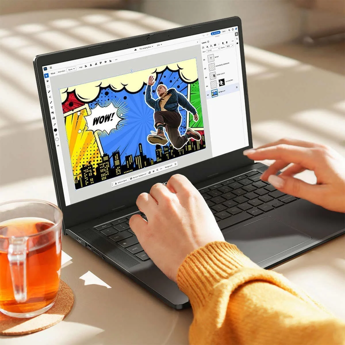 Acer Chromebook Plus 514 in use on a desk with someone working in a design app