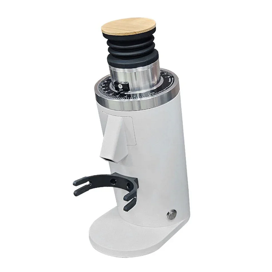 Turin DF54 single-dose flat-burr coffee grinder in white with bellows and portafilter fork, front three-quarter view