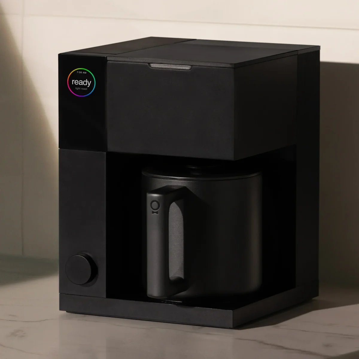Fellow Aiden on marble countertop showing thermal carafe and compact form factor