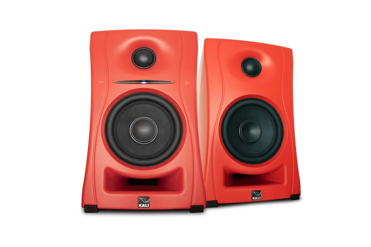 Kali Audio LP-UNF pair in red showing the distinctive 3D imaging waveguide, 4.5-inch woofer, and front-firing bass port