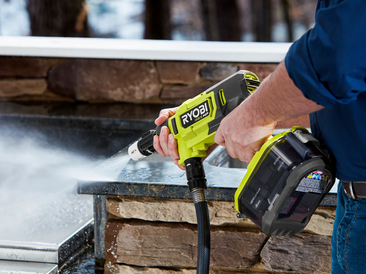 Ryobi 18V ONE+ HP EZClean being used to clean an outdoor stone surface