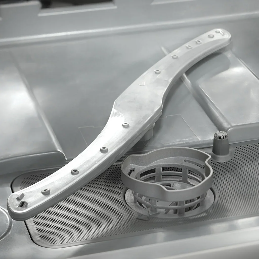 Danby DDW631SDB interior close-up showing the stainless steel tub, spray arm, and filter assembly