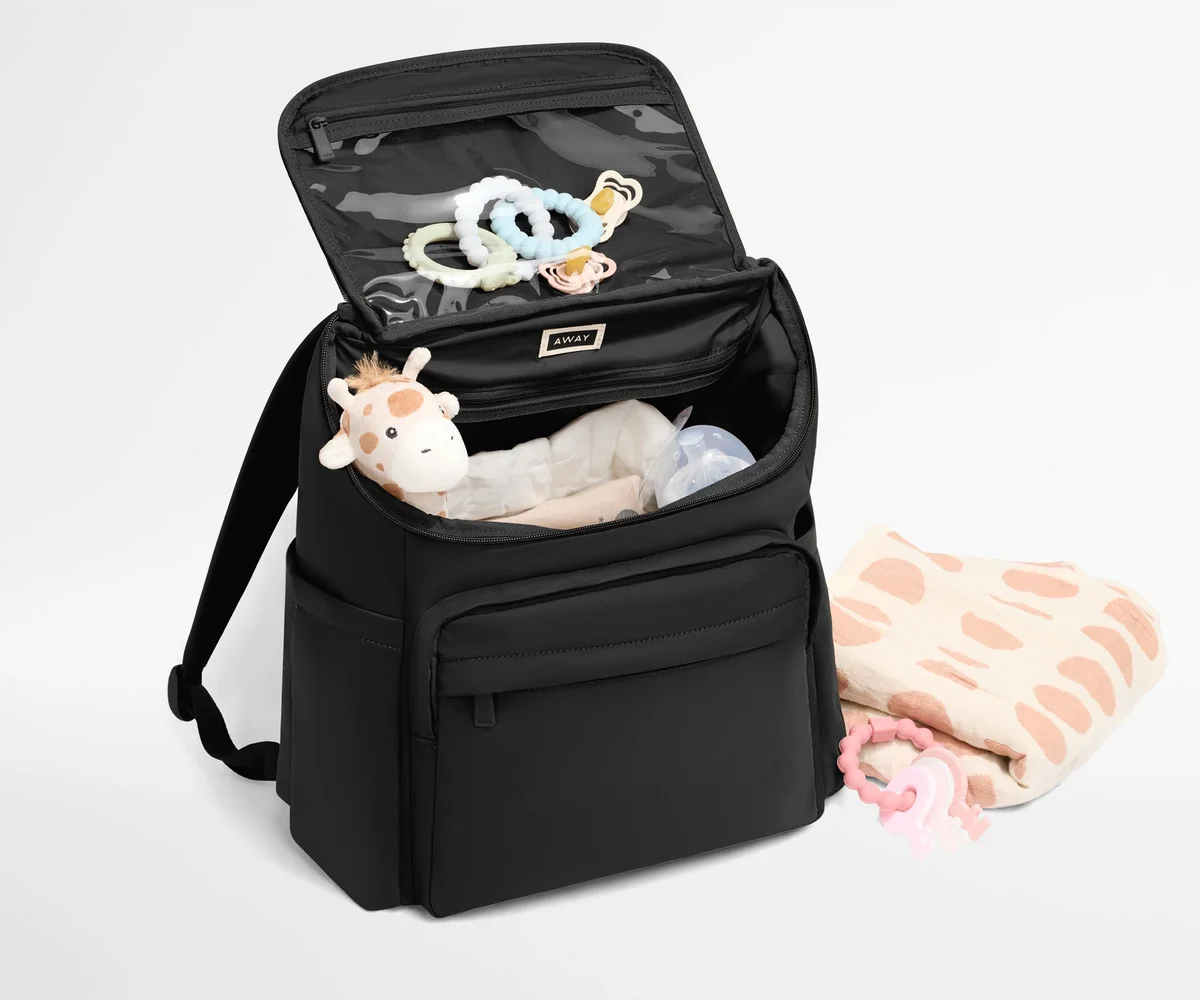 Away Featherlight Diaper Backpack open showing interior organization and top flap clear pocket