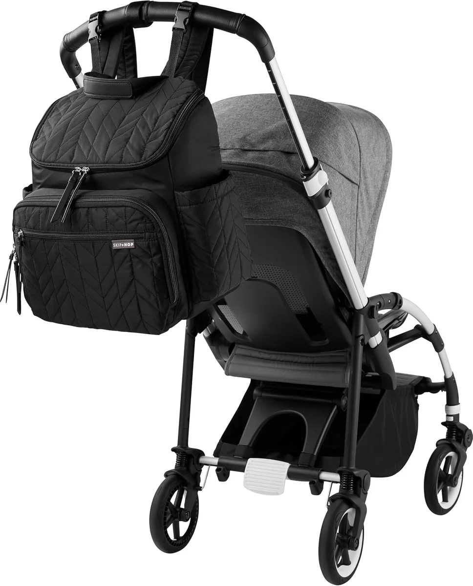 Skip Hop Forma Backpack attached to stroller handlebar with built-in straps
