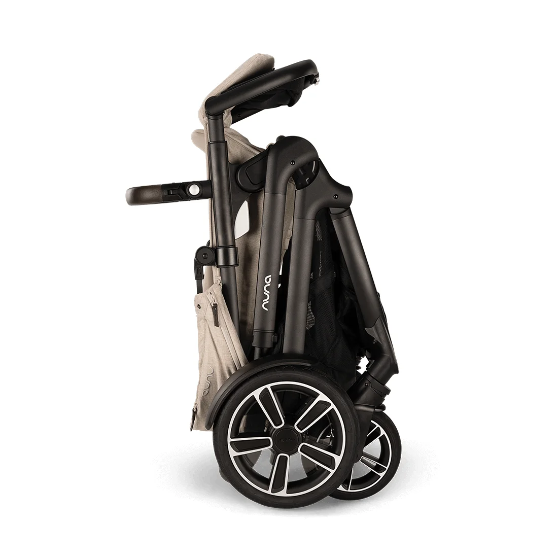 Nuna DEMI Next folded compact on white background showing its upright self-standing fold