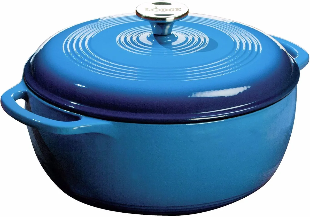 Lodge Essential Enamel Dutch Oven in blue, low front angle with lid on