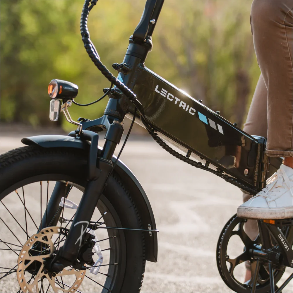 Lectric XP 4.0 integrated battery and frame detail while riding