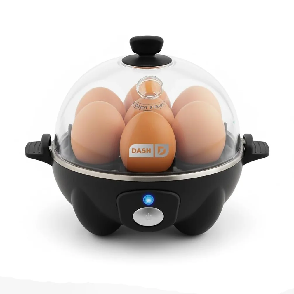 Dash Rapid Egg Cooker in black seen from a raised angle, with a full load of brown eggs in the boiling tray under the clear lid