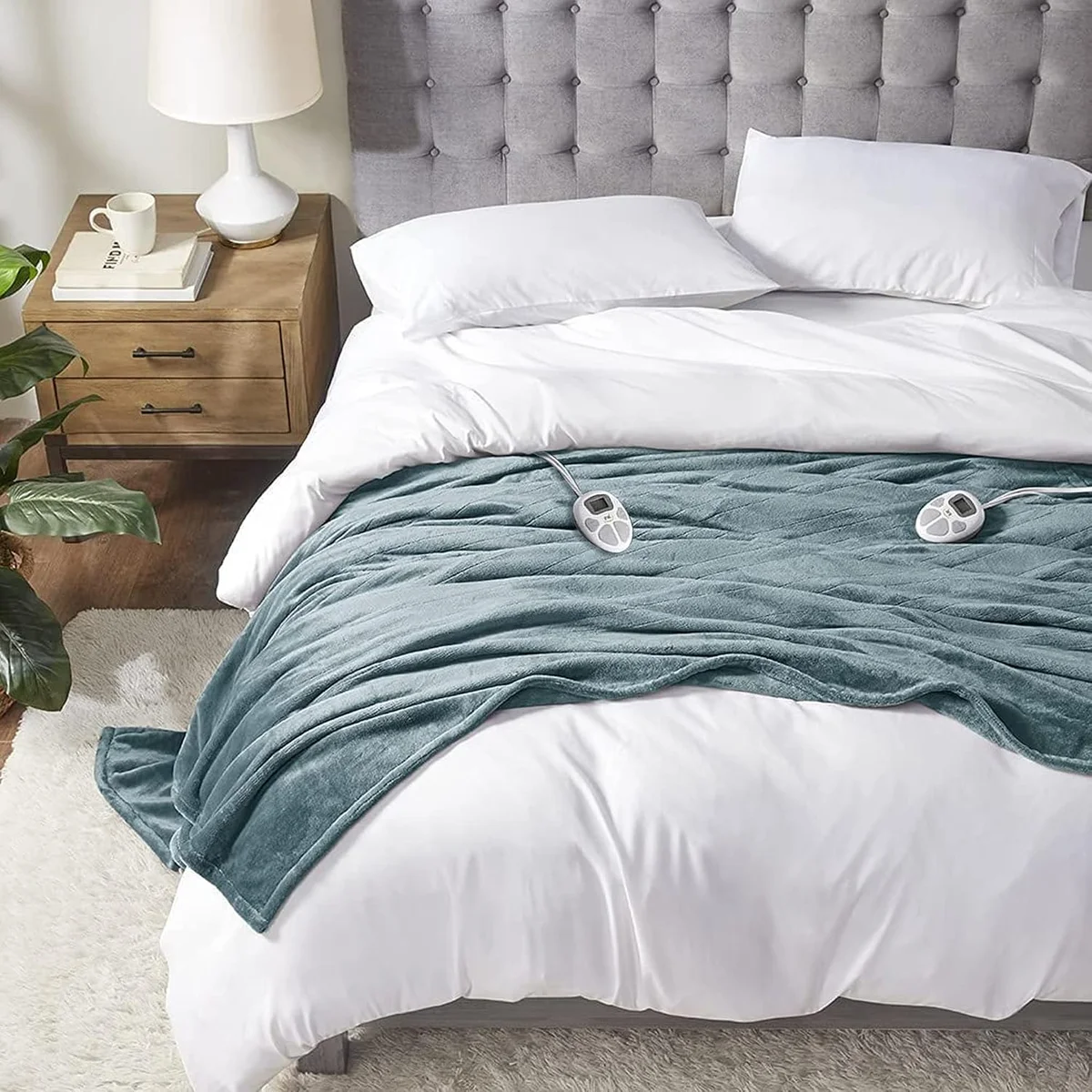 Serta Luxuriously Soft Plush heated blanket shown in teal on a queen bed
