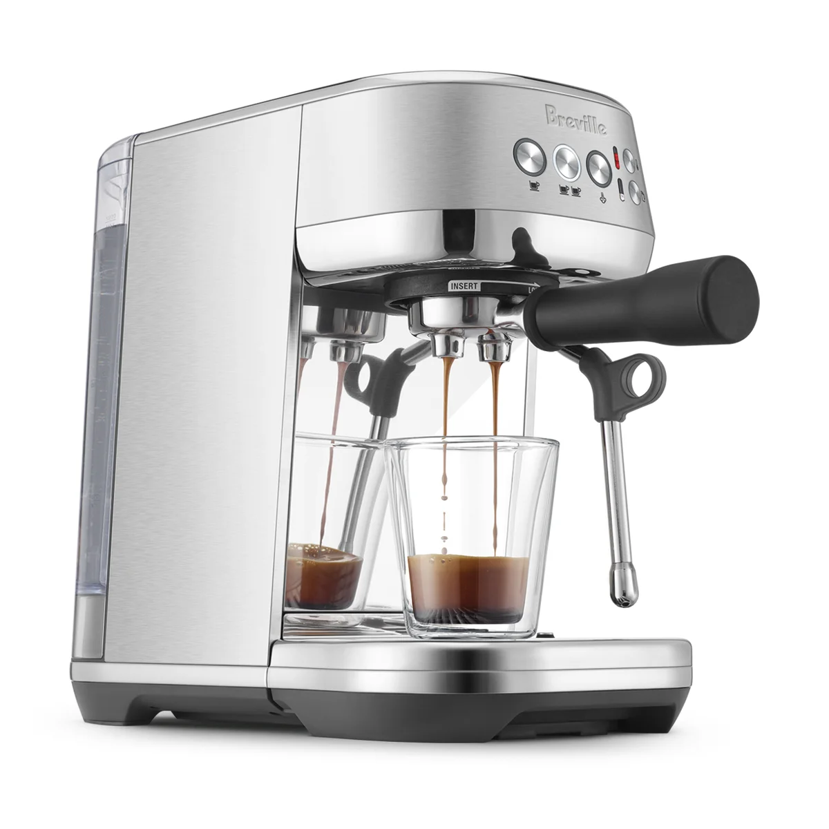 Breville Bambino Plus pulling a double espresso from the portafilter into two glasses, three-quarter view