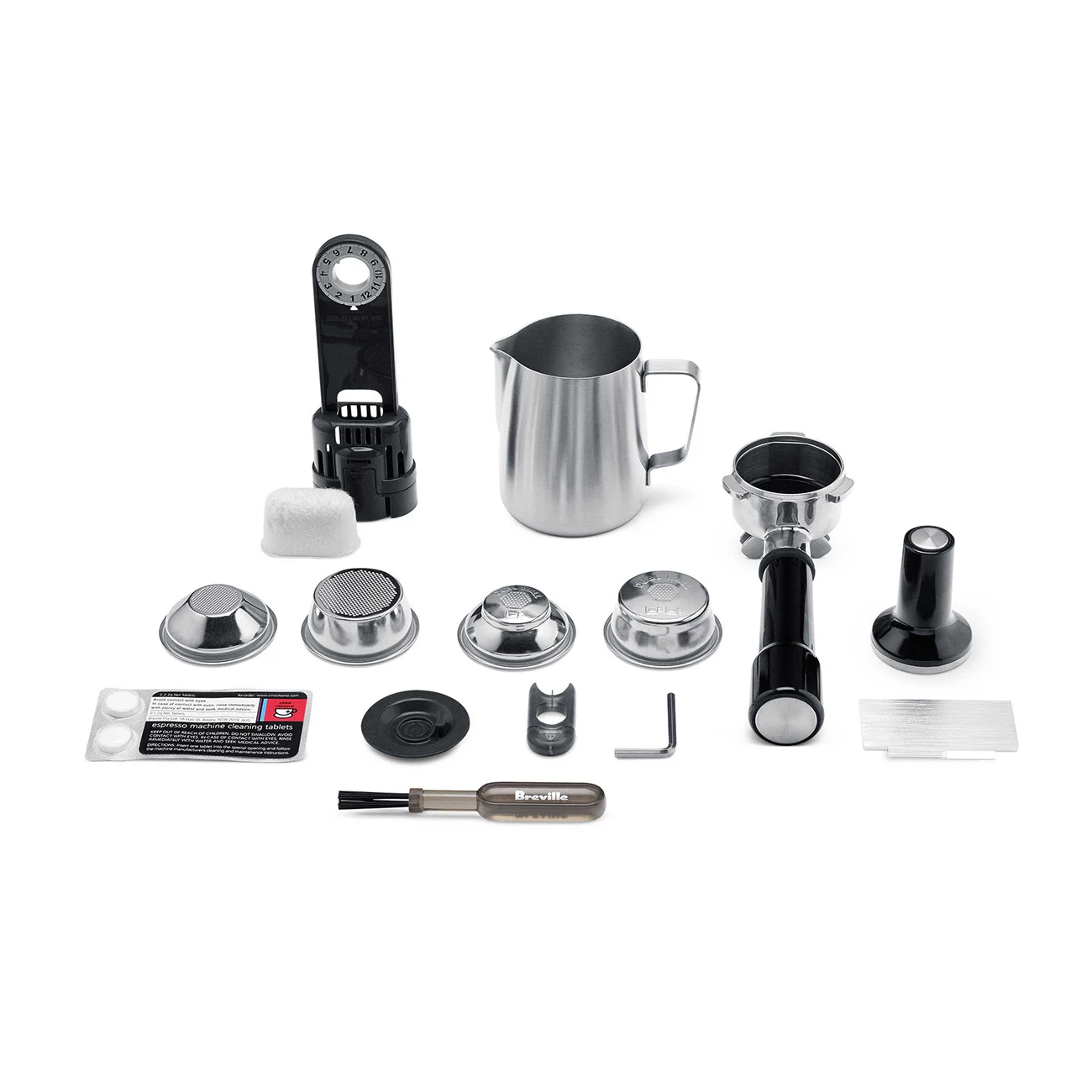 Breville Dual Boiler included accessories: portafilter, filter baskets, tamper, milk pitcher, cleaning kit