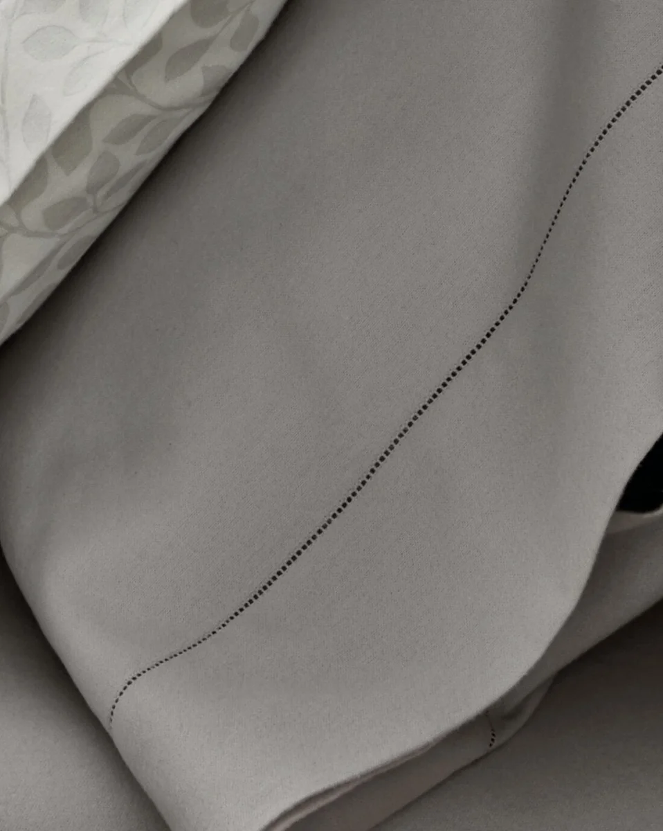 Close-up of the hemstitch drawn-thread border on Garnet Hill pima cotton flannel sheets