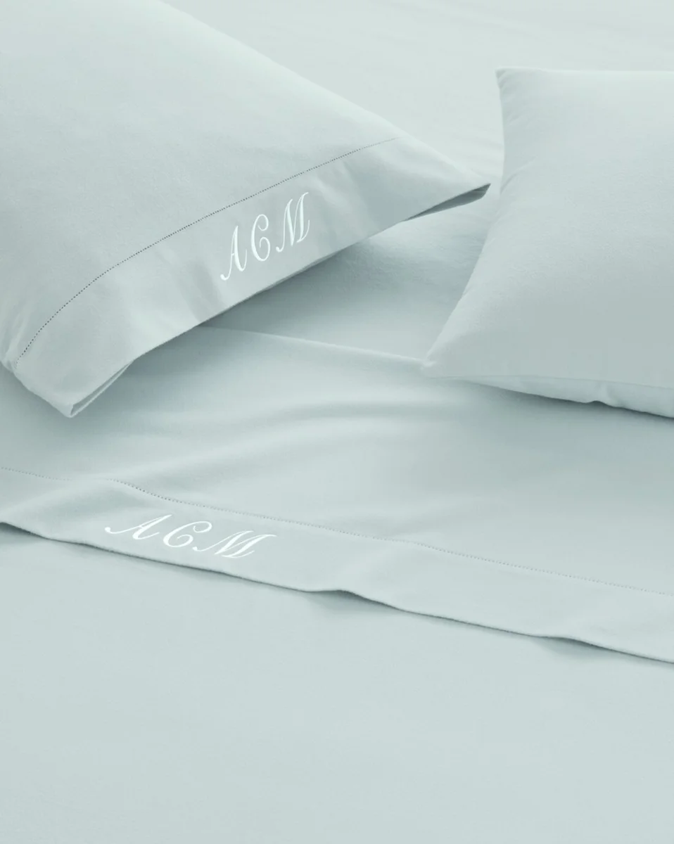 Garnet Hill pima flannel sheets and pillowcases in pale blue with hemstitch hem