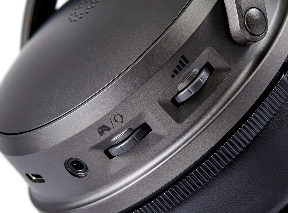 Audeze Maxwell 2 ear cup close-up with game/chat mix wheel, volume wheel, 3.5mm jack and USB-C port
