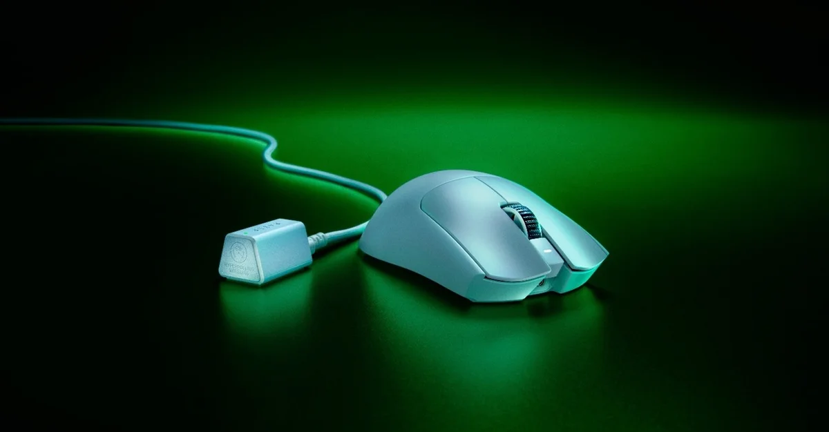 Razer Viper V3 Pro white variant with HyperSpeed wireless dongle on green-lit surface