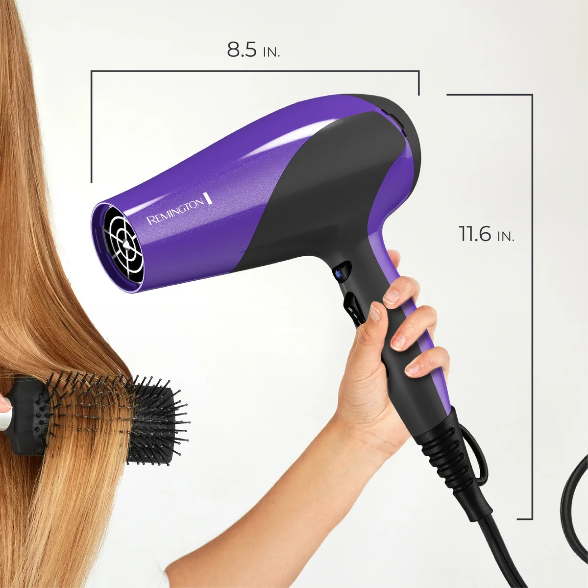Remington D3190 being held while drying hair with a round brush, showing dimensions