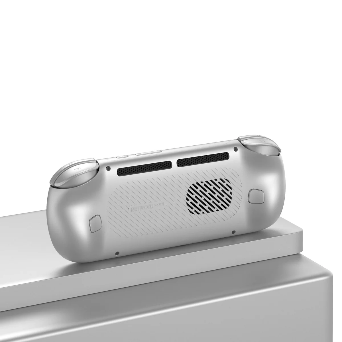 Retroid Pocket 6 silver rear view on pedestal showing cooling grille and ergonomic back contour