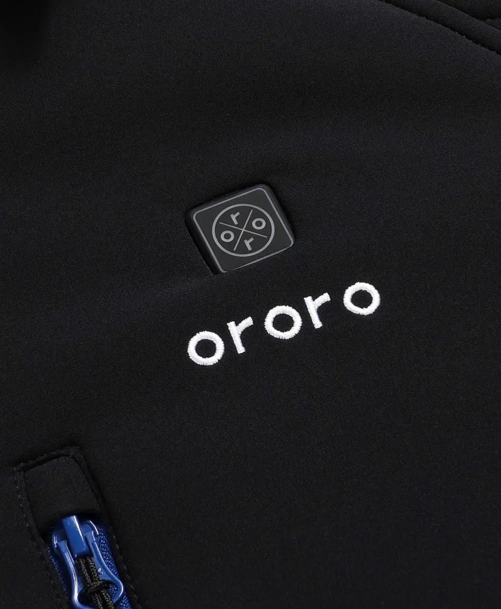 Close-up of the ORORO Men's Classic Heated Jacket chest heat-control button above the white embroidered ORORO logo and blue chest-pocket zipper