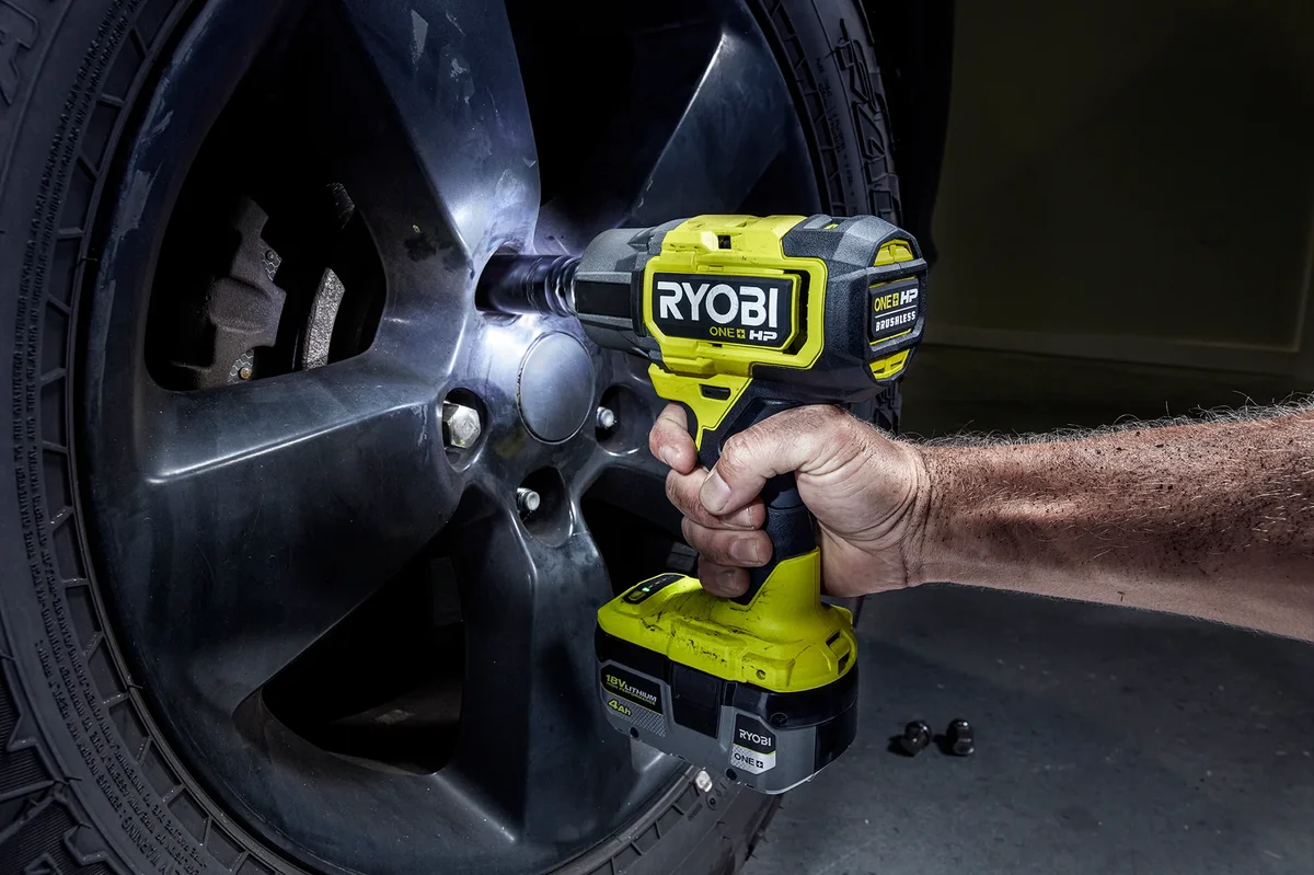 Ryobi P262 Impact Wrench removing wheel lug nuts with tri-beam LED worklights illuminated