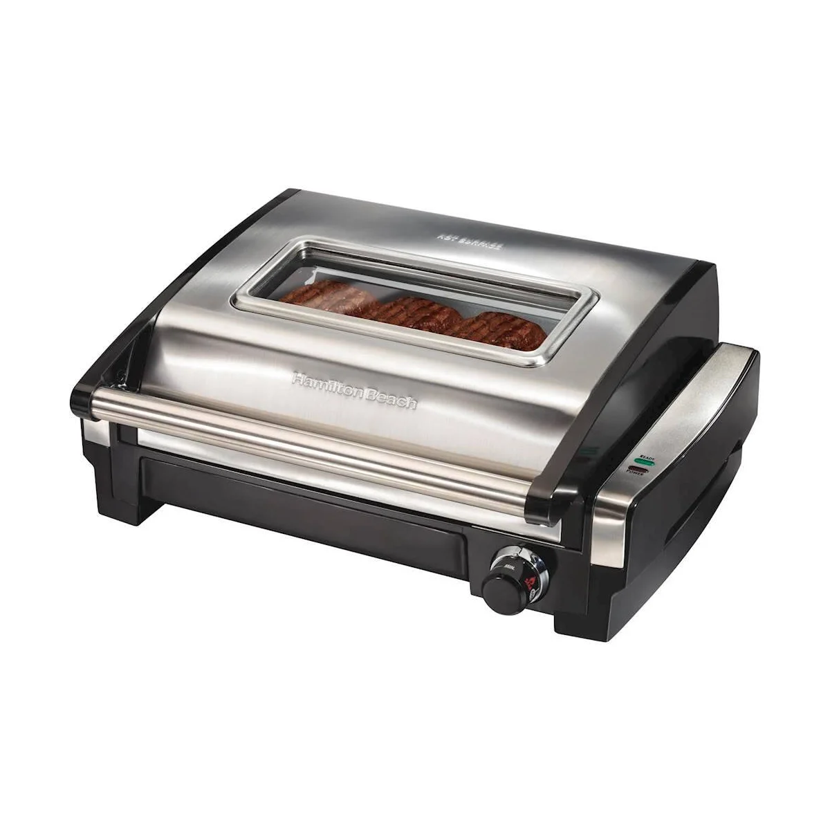 Hamilton Beach 25361 Searing Grill with the lid closed, showing the glass viewing window over steaks, the stainless handle, the temperature dial and the ready/power lights