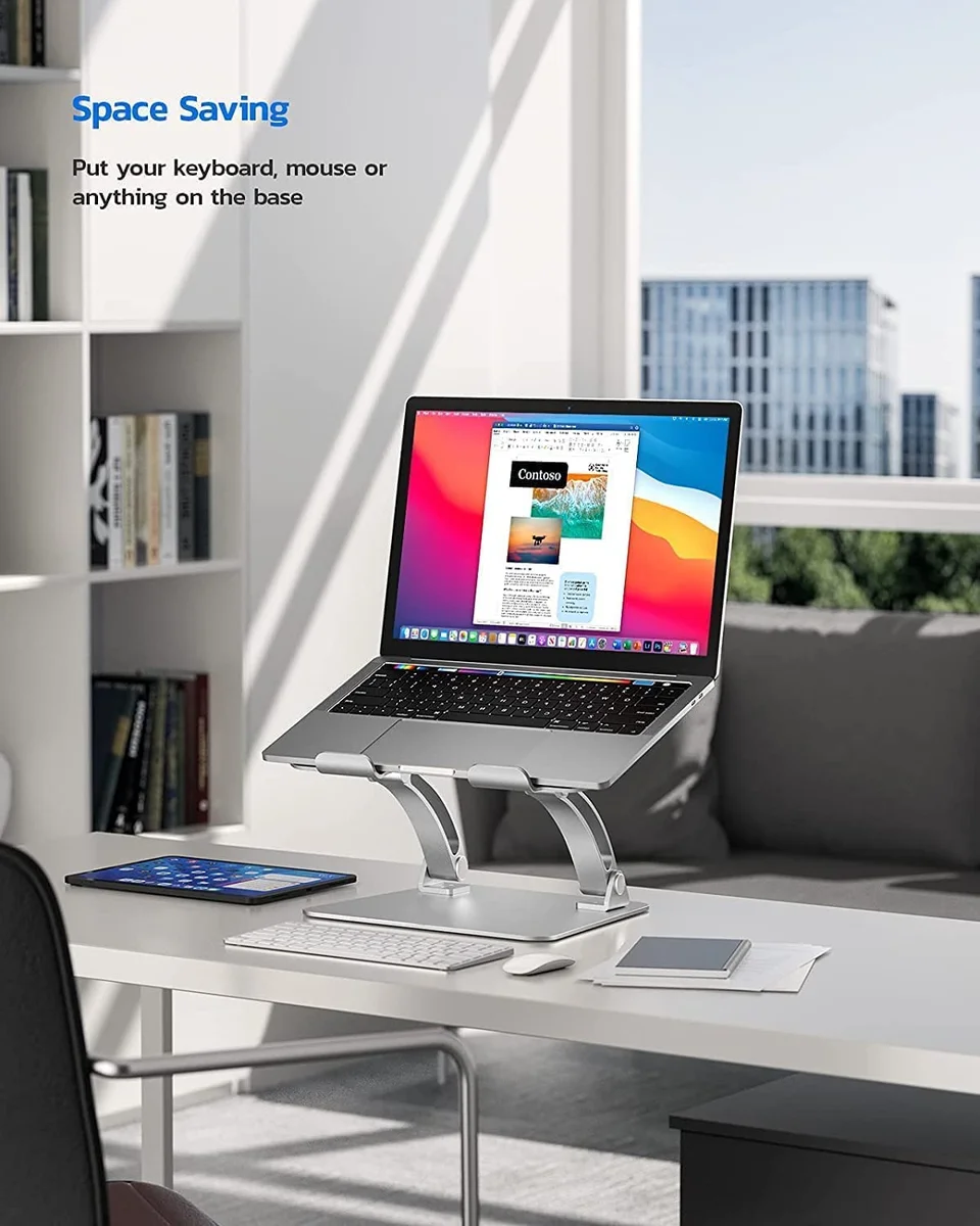 Nulaxy C1 laptop stand in use on a desk with keyboard and mouse tucked underneath the wide base platform