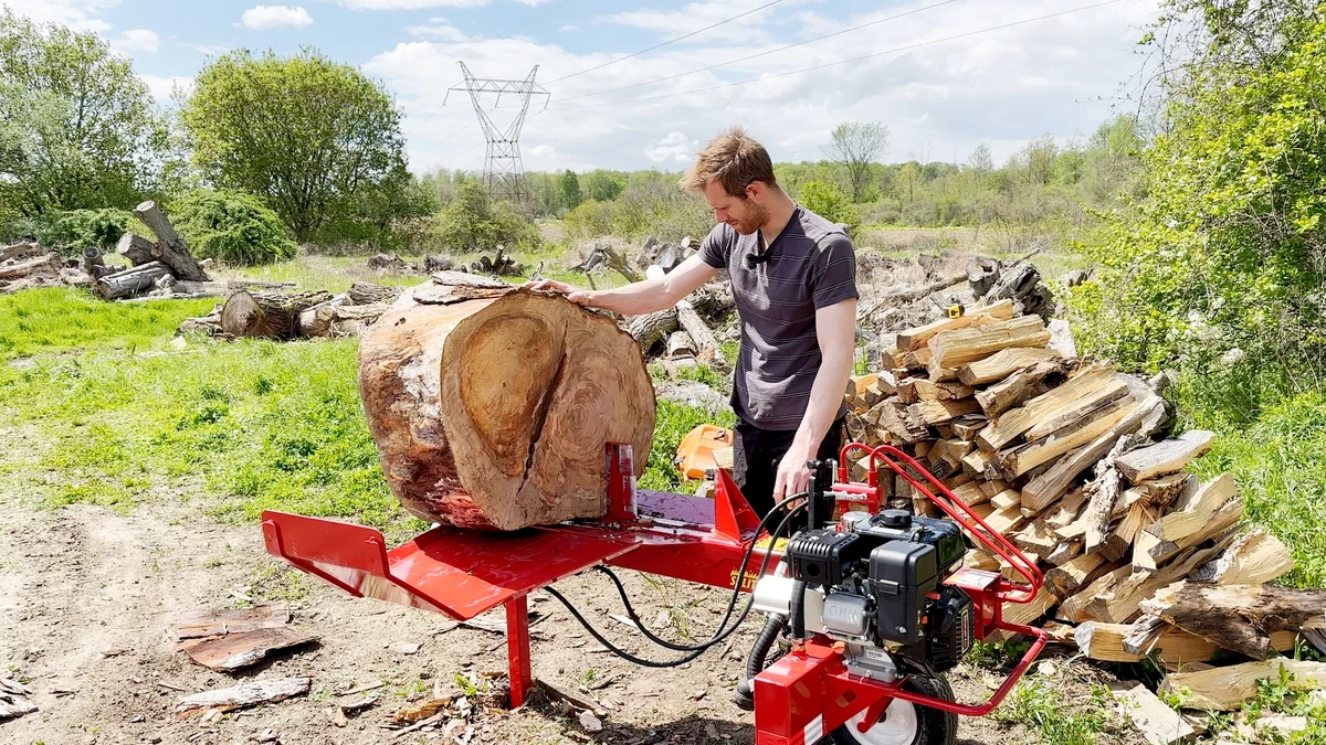 Split-Fire 2265 in use with man loading a large log round