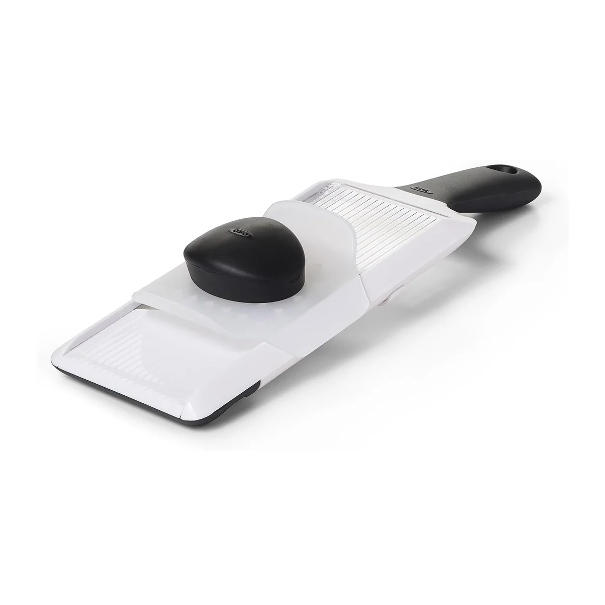 OXO Good Grips Hand-Held Mandoline Slicer three-quarter angle view with the clear food holder mounted on the slicing deck and black non-slip handle