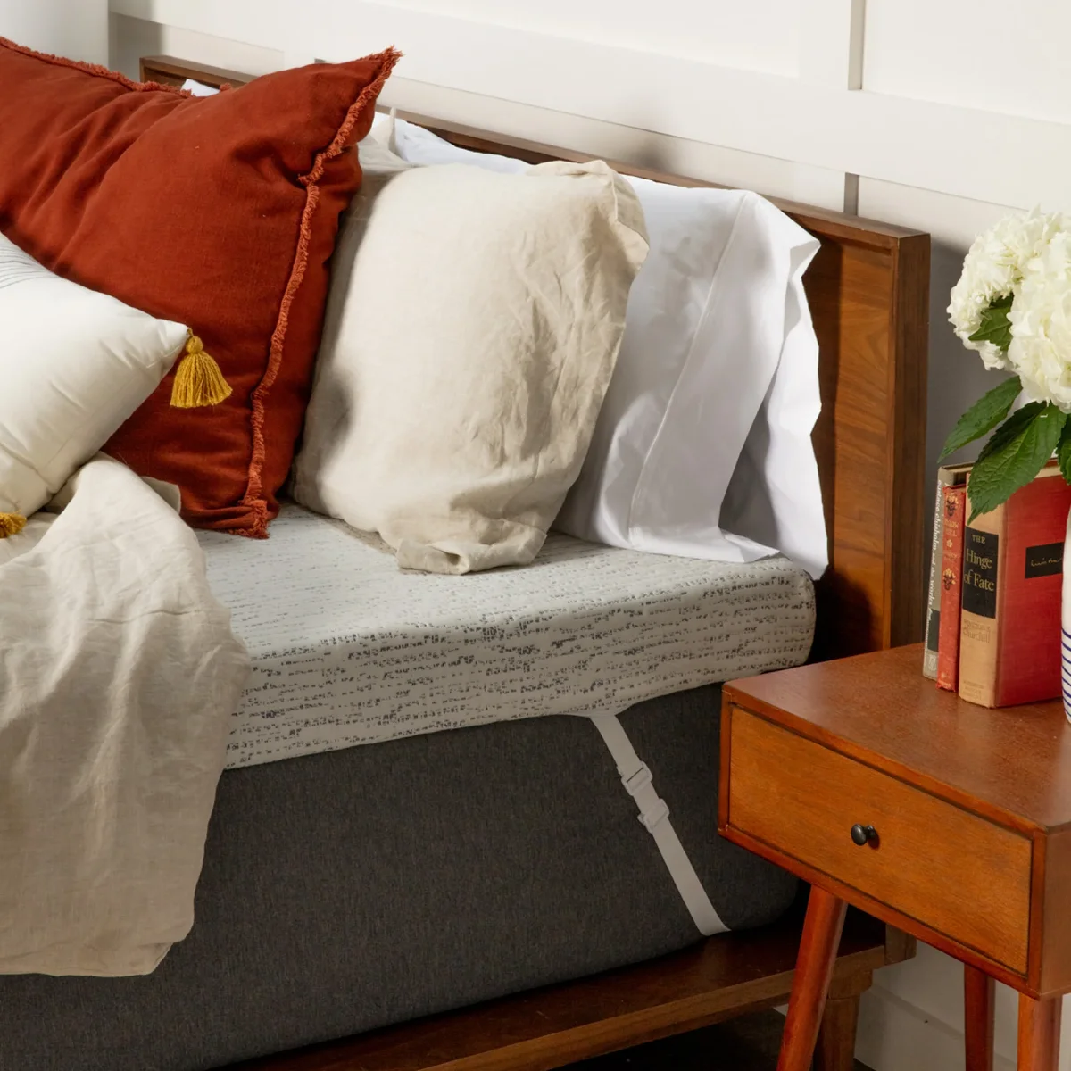 ViscoSoft Select High Density Mattress Topper installed on a bed with pillows and bedding, shown in a bedroom lifestyle setting