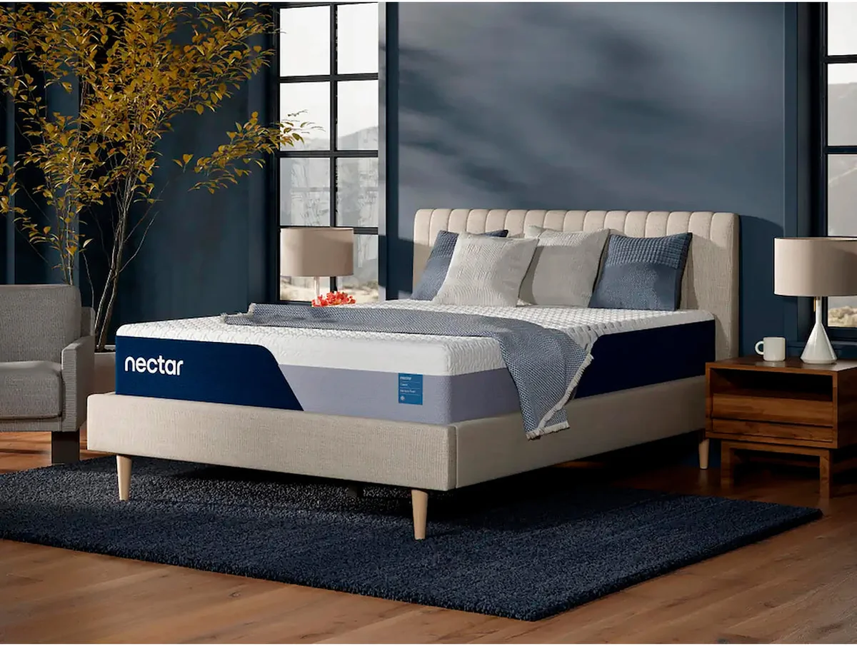 Nectar Classic mattress angled side view in styled dark blue bedroom