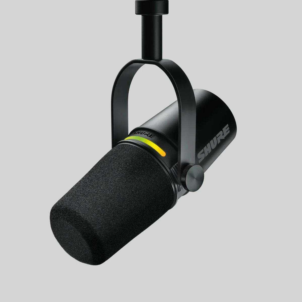 Shure MV7+ microphone 3/4 angle showing LED level indicator and yoke mount